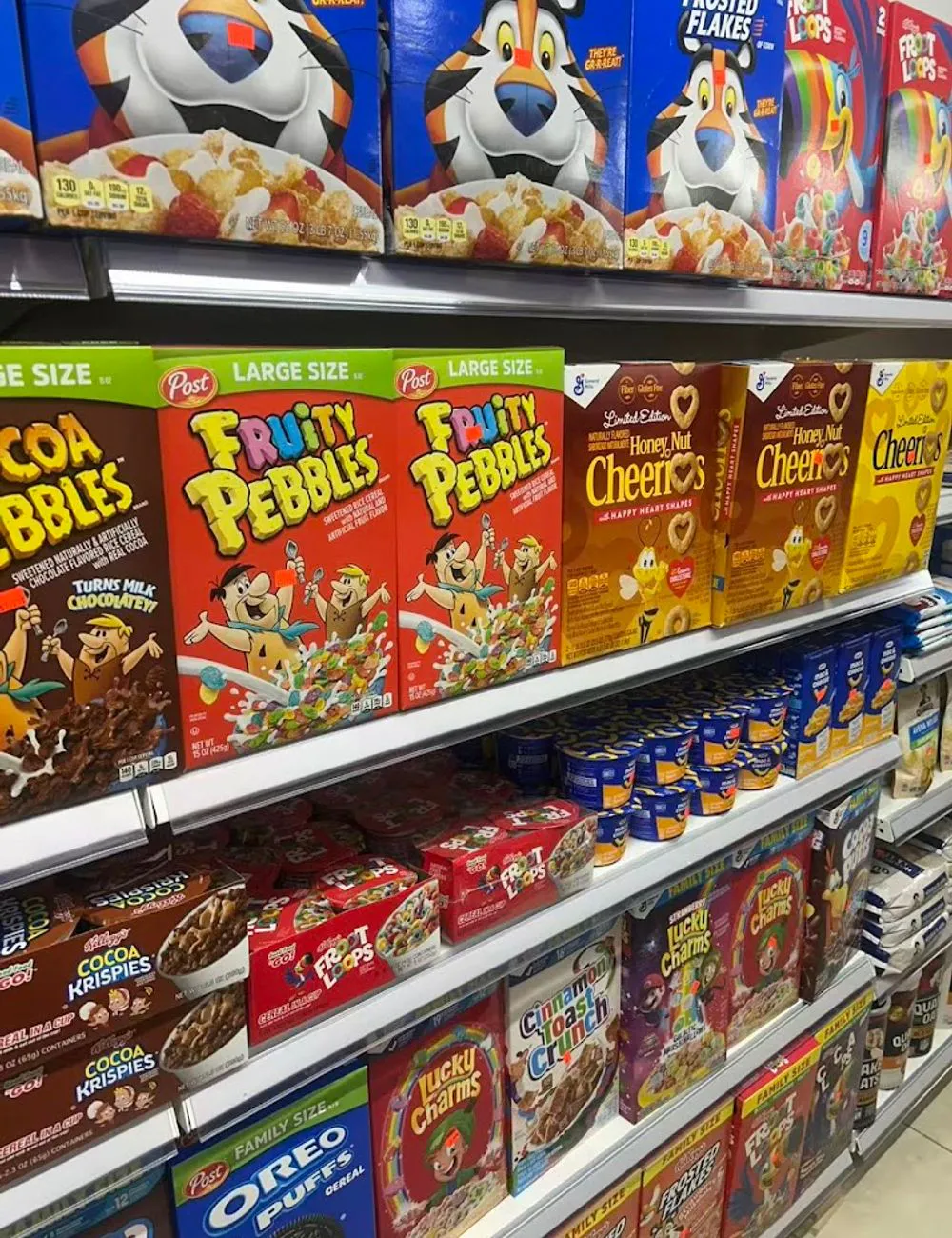 Breakfast cereal shelves with popular varieties at 105 Mini Market, a Supermarket & Fast Food Spot in Corona