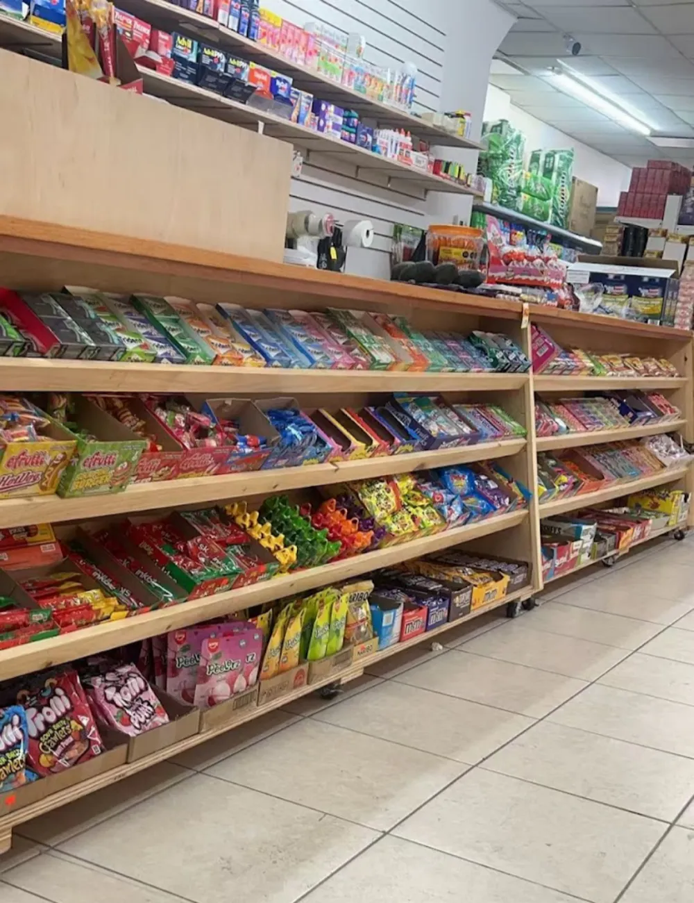 Candy aisle with assorted treats and gums at 105 Mini Market, a Supermarket & Fast Food Spot in Corona
