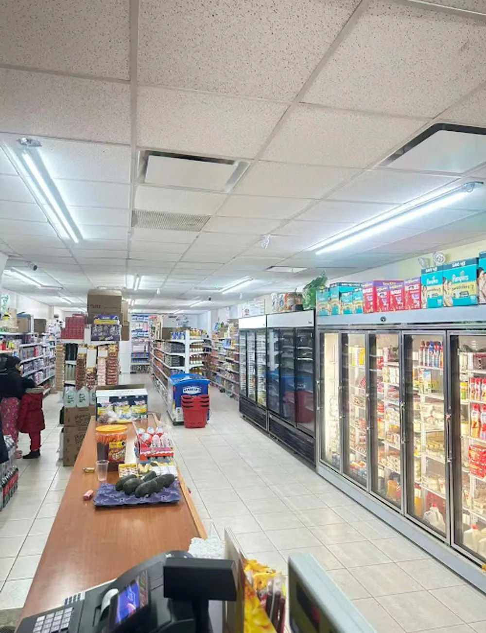 Wide view of the mini market interior at 105 Mini Market, a Supermarket & Fast Food Spot in Corona